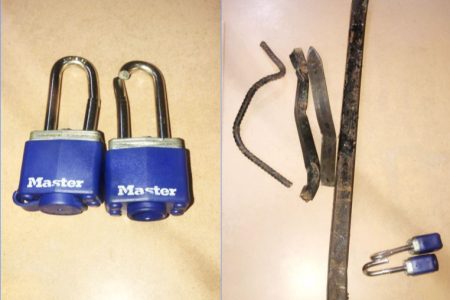 The broken padlocks and steel rods that were found at the scene. 