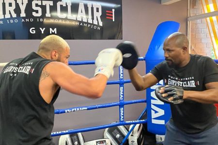 Former world champion, Guyana’s Gairy St Clair, right,  is not giving up on his dream of staging two world titles fights in Guyana. 