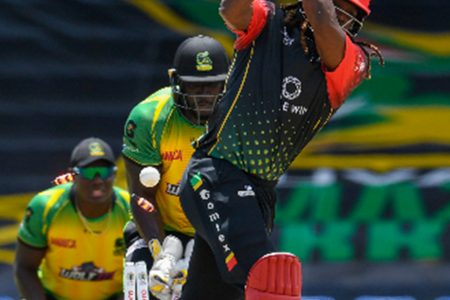 Chris Gayle misses a swing at Chris Green (out of photo) and is bowled for 12 against Jamaica Tallawahs yesterday. (Photo courtesy CPL Media) 