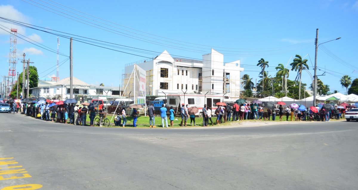 With the availability of the Sputnik V 2nd dose, there was a large turnout for COVID-19 vaccines at the Ministry of Health, Brickdam yesterday morning.  The line stretched into Hadfield Street. (Orlando Charles photo) 