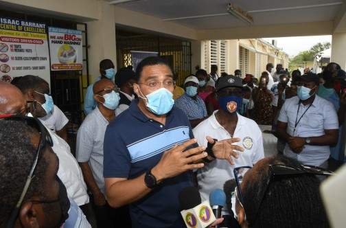 Prime Minister Andrew Holness addresses members of the media while touring the COVID-19 vaccination site at Isaac Barrant Health Centre in St Thomas, yesterday. (Photo: Karl Mclarty) 