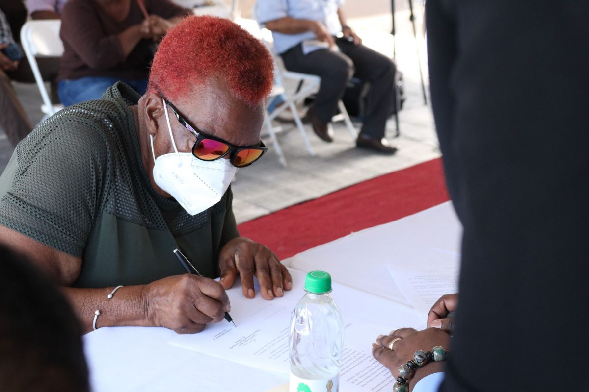 One of the recipients signing her contract (CH&PA photo)