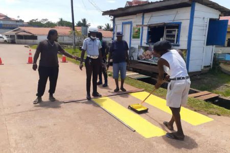 Ranks of the Mahdia Police Station’s Traffic Department in collaboration with residents, recently repainted the pedestrian crossings at the Mahdia Secondary School,  Primary School, Nursery School and District Hospital. (Police photo)