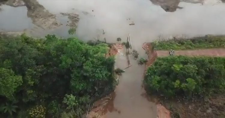  The middle section of this EPA drone photo shows where the road was washed away by the torrent from the reservoir 