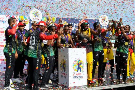 The St Kitts/Nevis Patriots celebrate with the trophy after winning the 2021 Hero Caribbean Premier League final yesterday against the St Lucia Kings at Warner Park, Basseterre, St Kitts/Nevis. (Photo Randy Brooks-CPL T20/Getty Images)