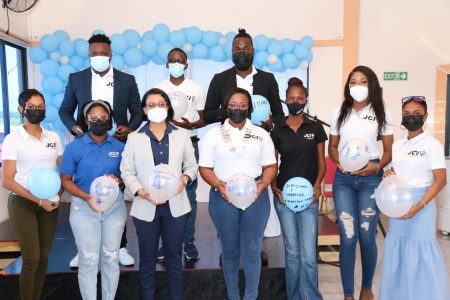 Susan Rodrigues, Minister within the Ministry of Housing and Water (third from left in the front row) and the Junior Chambers International-Guyana team pose with their peace dove balloons