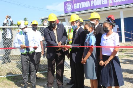 The ribbon being cut
