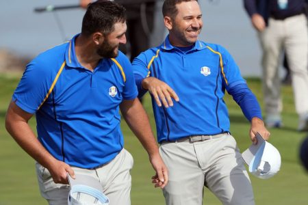 Team Europe player Jon Rahm celebrates with Team Europe player Sergio Garcia on the 17th green during day one foursome rounds for the 43rd Ryder Cup golf competition at Whistling Straits. Mandatory Credit: Kyle Terada-USA TODAY Sports