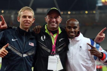 Salazar (centre) celebrates with Galen Rupp (left) and Mo Farah (right) at the London 2012 Olympics.