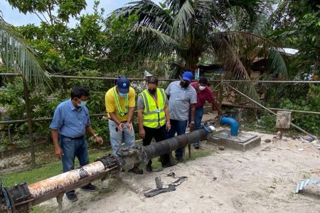 GWI CEO Shaik Baksh (left) at the well site (GWI photo)
