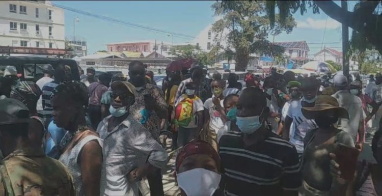 The scene outside the Brickdam Police Station yesterday after the arrests were made.