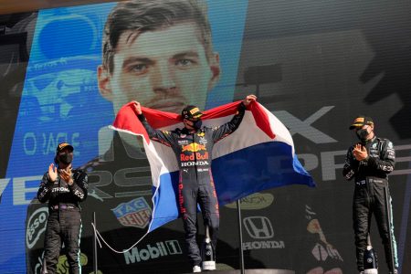 Red Bull’s Max Verstappen celebrates on the podium after winning the race with Mercedes’ Lewis Hamilton finishing second and Mercedes’ Valtteri Bottas finishing third Pool via REUTERS/Francisco Seco 