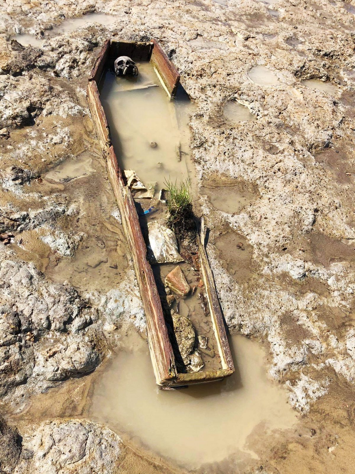 One of the coffins seen along the Number 71 Village foreshore yesterday. 