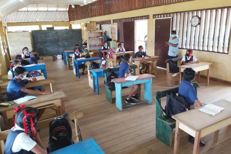 Students of Mabaruma Primary School observing social distancing on their first day back to school (Ministry of Education photo)