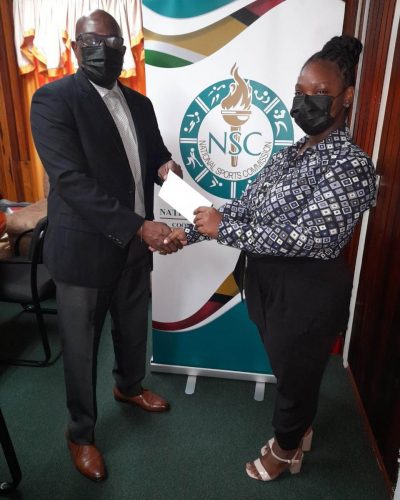 Director of Sport, Steve Ninvalle (L), handing over the NSC’s cheque to the GRFU’s Assistant/Secretary Treasurer, Tiffany Spencer.