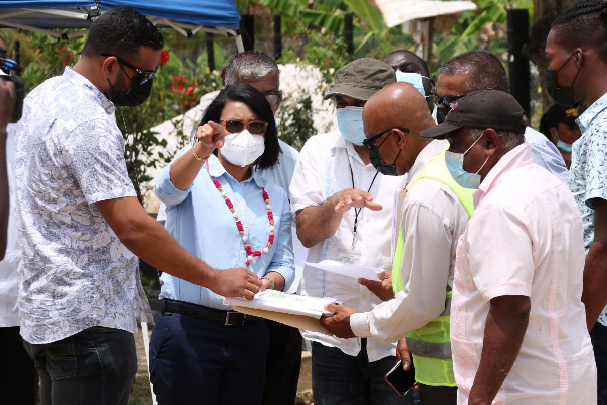 From left are Permanent Secretary Andre Ally, Minister within the Ministry of Housing and Water Susan Rodrigues and other officials looking at the layout of the area (CH&PA photo)