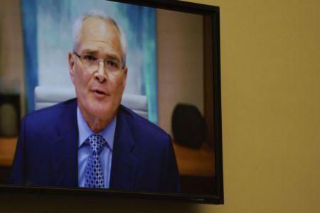 ExxonMobil CEO Darren Woods speaks via video link during a House hearing in Washington, DC, on Oct 28, 2021.PHOTO: BLOOMBERG