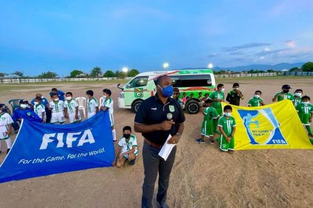 The Guyana Football Federation Saturday donated a 19-seater HiAce bus (in the background) to the Rupununi Football Association.