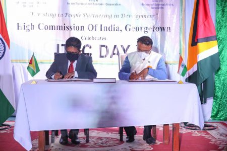 In photo, Senior Minister in the Office of the President with responsibility for Finance Dr Ashni Singh (left) and Dr K. J. Srinivasa, High Commissioner of India to Guyana signing the agreement 