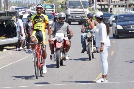 Star rider, Jamual John returned to the local cycling scene with a bang yesterday, soloing to victory in the inaugural Wilbert Benjamin Memorial 70-mile road race in Berbice. (Emmerson Campbell photo)