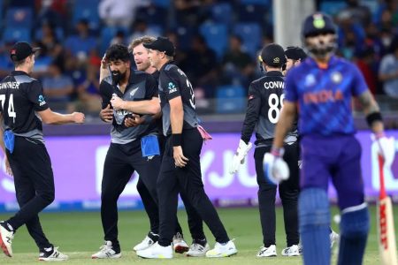 The New Zealand cricketers celebrate the fall of another Indian batsman’s wicket. (Photo courtesy ICC T20 World Cup)