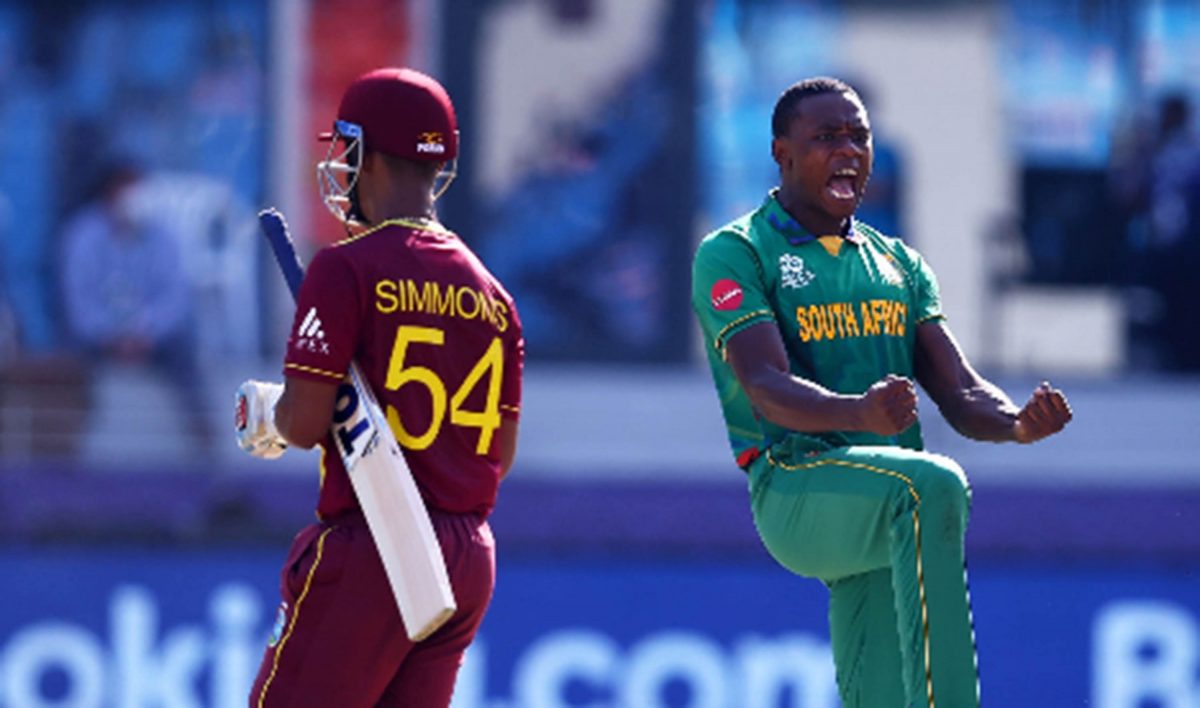 Lendl Simmons trudges off following his pedestrian 16 from 35 deliveries against South Africa on Tuesday, as fast bowler Kagiso Rabada celebrates.