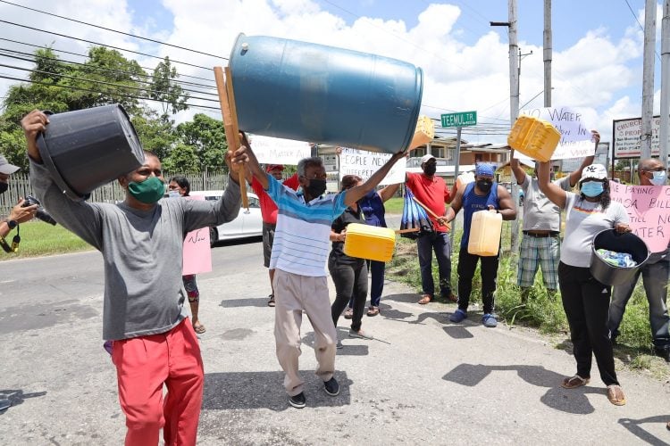 Resident of Teemul Trace in Penal protest for water, yesterday. The residents said they haven't received water for almost a month.