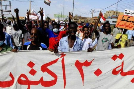 Protesters carry a banner and shout slogans as they march against the Sudanese military's recent seizure of power and ousting of the civilian government, in the streets of the capital Khartoum, Sudan October 30, 2021.
Reuters/Mohamed Nureldin
