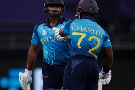 FILE PHOTO: Cricket - ICC Men's T20 World Cup 2021 - Super 12 - Group 1 - Australia v Sri Lanka - Dubai International Stadium, Dubai, United Arab Emirates - October 28, 2021 Sri Lanka's Charith Asalanka with Kusal Perera after Asalanka hit a four REUTERS/Hamad I Mohammed