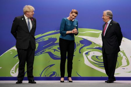 Britain's Prime Minister Boris Johnson and United Nations Secretary General Antonio Guterres greet Denmark's Prime Minister Mette Frederiksen during arrivals at the UN Climate Change Conference (COP26) in Glasgow, Scotland, Britain November 1, 2021. Christopher Furlong/Pool via REUTERS