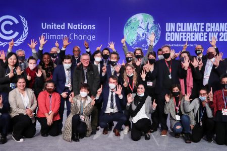 Delegates pose for a picture during the UN Climate Change Conference (COP26) in Glasgow, Scotland, Britain November 13, 2021. (REUTERS)