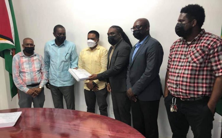 Minister of Local Government and Regional Development Nigel Dharamlall (third from left) with principals of St8ment Investment Inc and other officials at the signing of the contract (MLGRD photo)