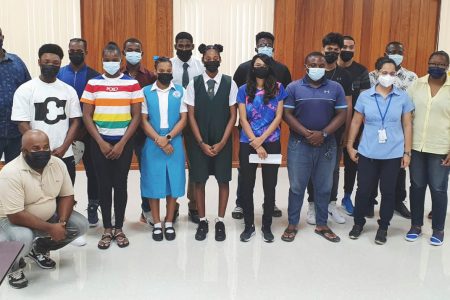 Members of Guyana’s delegation pose for a photo following the press briefing held yesterday at GOA’s headquarters in Liliendaal.