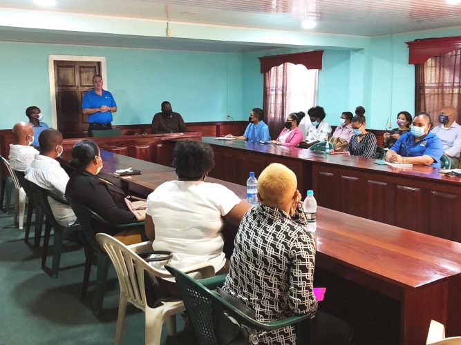 GTT’s CEO, Damian Blackburn at a recent meeting with the Mayor of Bartica and residents (GTT photo)