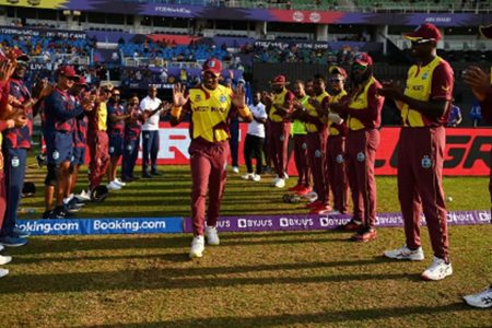 Dwayne Bravo is given a guard of honour as he takes the field for the final time for West Indies yesterday
