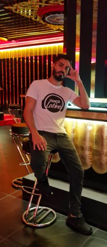 Karlo wearing one of his Esencia Latina t-shirts