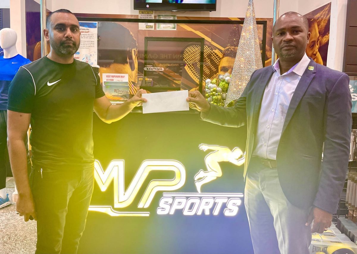 GFF President Wayne Forde (right) receives the sponsorship cheque from MVP Sports Managing Director Ian Ramdeo.