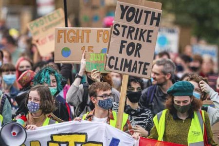 Protesters take part in a climate protest in Glasgow as part of the Global Youth Strike For Climate in the lead up to COP26 climate summit in the city. Photograph: Ewan Bootman/NurPhoto/Rex/ Shutterstock