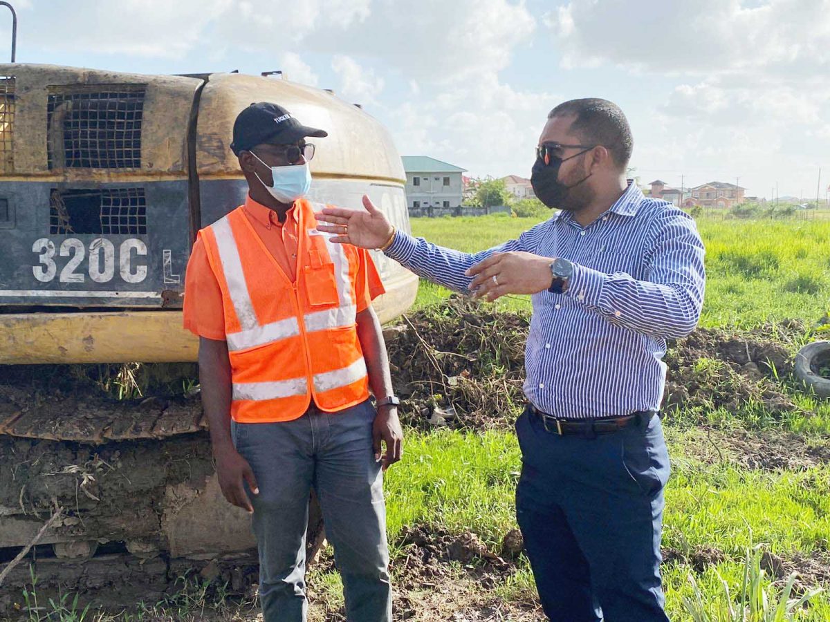 Regional Chairman Daniel Seeram (right) interacts with Chief Transport Planning Officer, Patrick Thompson during the site visit on November 8