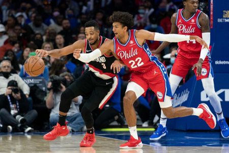  Philadelphia 76ers guard Matisse Thybulle (22) knocks the ball from Portland Trail Blazers guard CJ McCollum (3) during the fourth quarter at Wells Fargo Center. Mandatory Credit: Bill Streicher-USA TODAY Sports