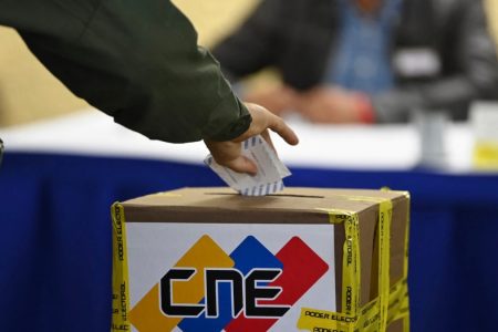 A member of the Bolivarian National Guard casts his vote at a polling station during regional and municpal elections in Fuerte Tiuna in Caracas, on Nov. 21, 2021.
