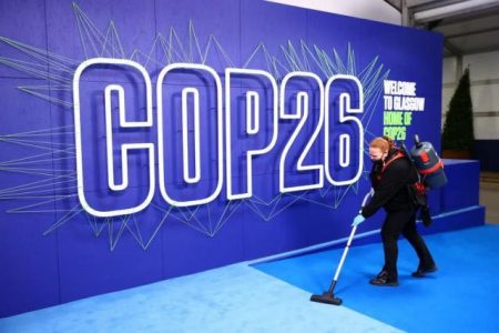 An employee cleans before the arrival of leaders for the UN Climate Change Conference (COP26) in Glasgow, Scotland, UK November 1, 2021. (Photo: Adrian Dennis/Pool via REUTERS)
