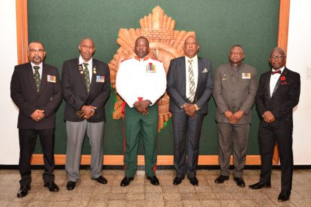 The Guyana Defence Force (GDF) on Thursday evening hosted a traditional “Dining out” dinner for five of its recently retired Officers.
A release from the GDF said that the former officers honoured were Colonel (Ret’d) Paul Arthur, Lieutenant Colonels (Ret’d) Ramkarran Doodnauth and Lawrence Fraser, Commander (Ret’d) Orin Porter and Major (Ret’d) Edward Peters. The event was held at the Officers’ Mess, Base Camp Ayanganna.
Chief of Staff Brigadier Godfrey Bess and other senior officers were present.
From left are: Lieutenant Colonel (Ret’d) Ramkarran Doodnauth, Major (Ret’d) Edward Peters, Chief of Staff Brigadier Godfrey Bess, Colonel (Ret’d) Paul Arthur, Lieutenant Colonel (Ret’d) Lawrence Fraser and Commander (Ret’d) Orin Porter. (Photography by LCPL Joshua Forrester of the G9 Branch)