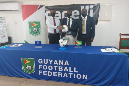 President of the GFF Wayne Forde (centre) flanked by tournament partners Kashif and Shanghai Directors Kashif Muhammad and Aubrey ‘Shanghai’ Major at the official launch of the GFF Super 16 year-end tournament.
