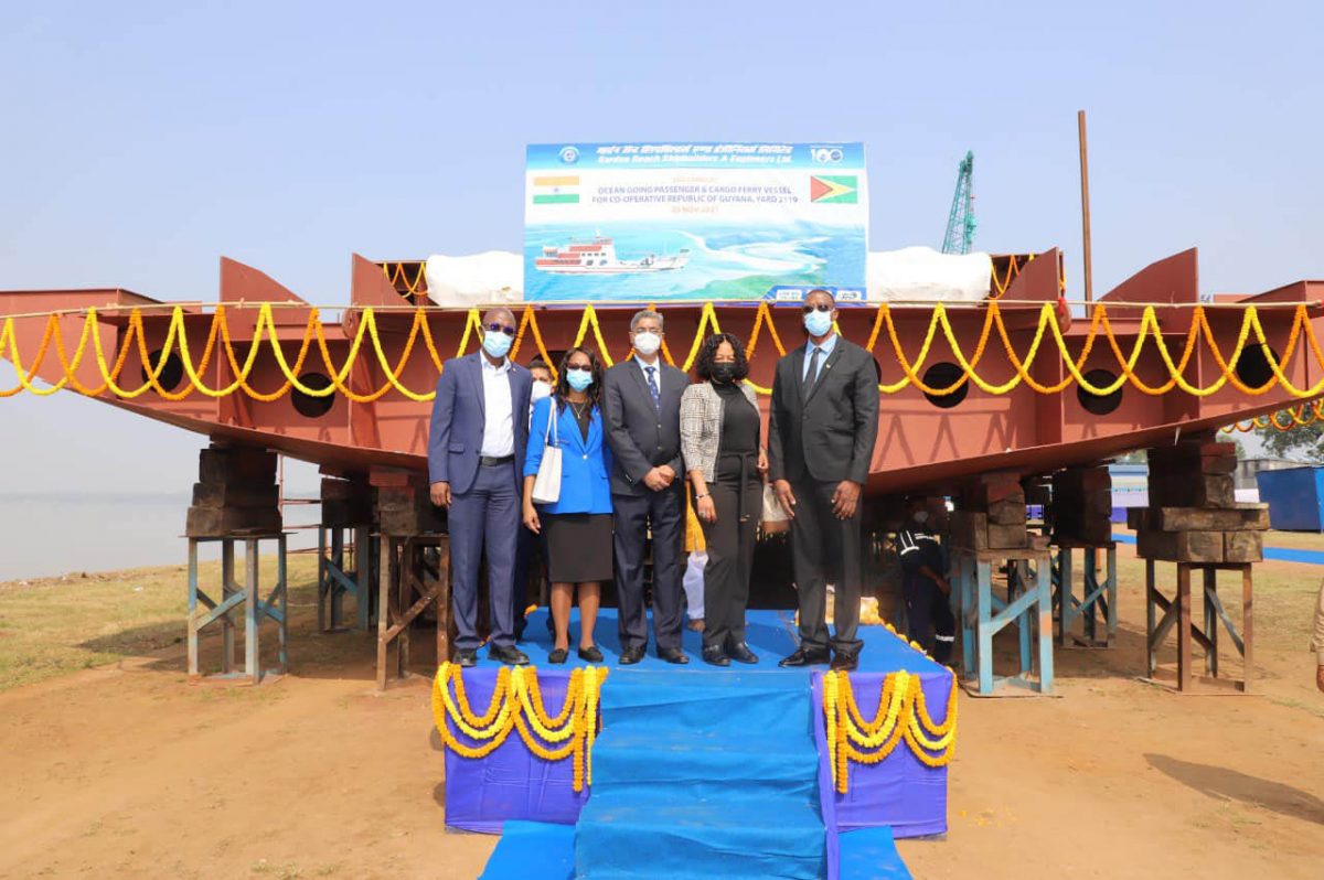 Officials of the Indian company and from Guyana at the launching of the keel (Ministry of Public Works photo)