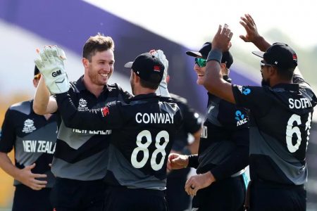 The New Zealand cricketers celebrate their advance to the semi-finals.