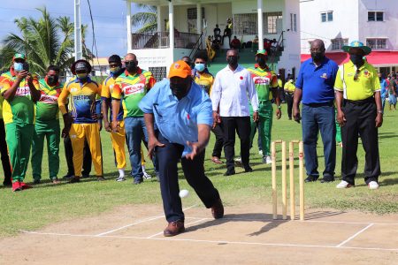 Prime Minister Mark Phillips bowls the first ball of the tournament (Romario Samaroo photo)
