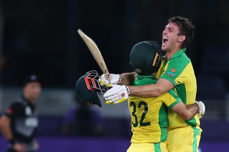 Cricket - ICC Men's T20 World Cup Final - New Zealand v Australia- Dubai International Cricket Stadium, Dubai, United Arab Emirates - November 14, 2021 Australia's Mitchell Marsh and Glenn Maxwell celebrate winning the ICC Men's T20 World Cup REUTERS/Satish Kumar