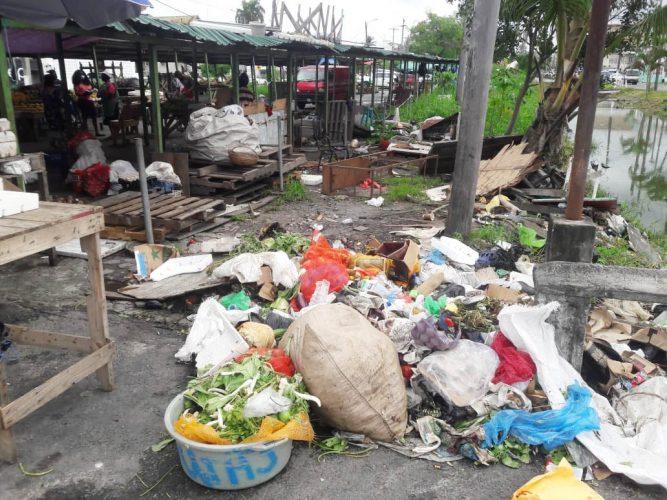 Spoilt produce along with waste from vendors discarded on the Merriman Mall. (Orlando Charles photo)