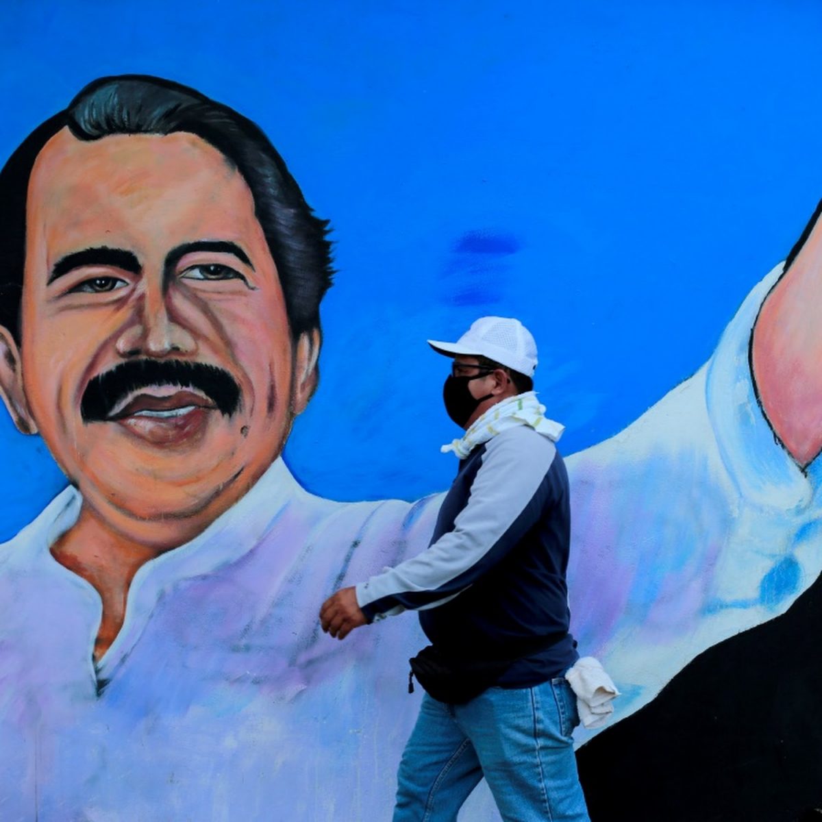A man walks by a mural depicting Nicaraguan President Daniel Ortega, in Managua, Nicaragua, March 30 2020. Picture: REUTERS/OSWALDO RIVAS